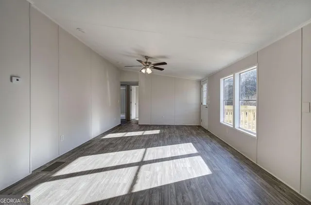 a view of an empty room and window