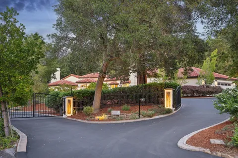 a view of a house with backyard from a patio