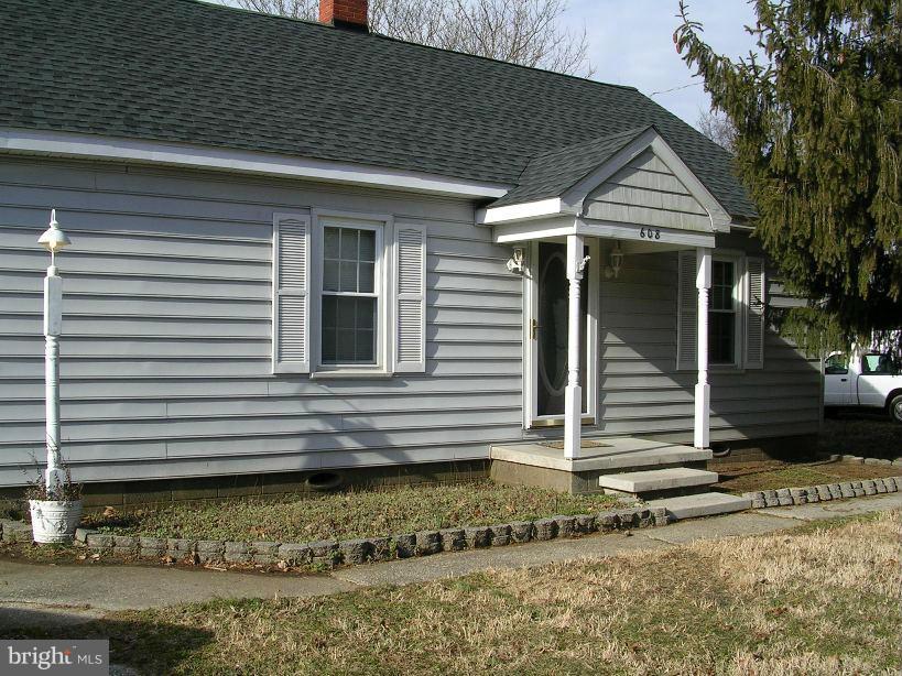 608 Wye Mills Road Queenstown, MD 21658 - Photo 1 of 17 a view of a house with a yard