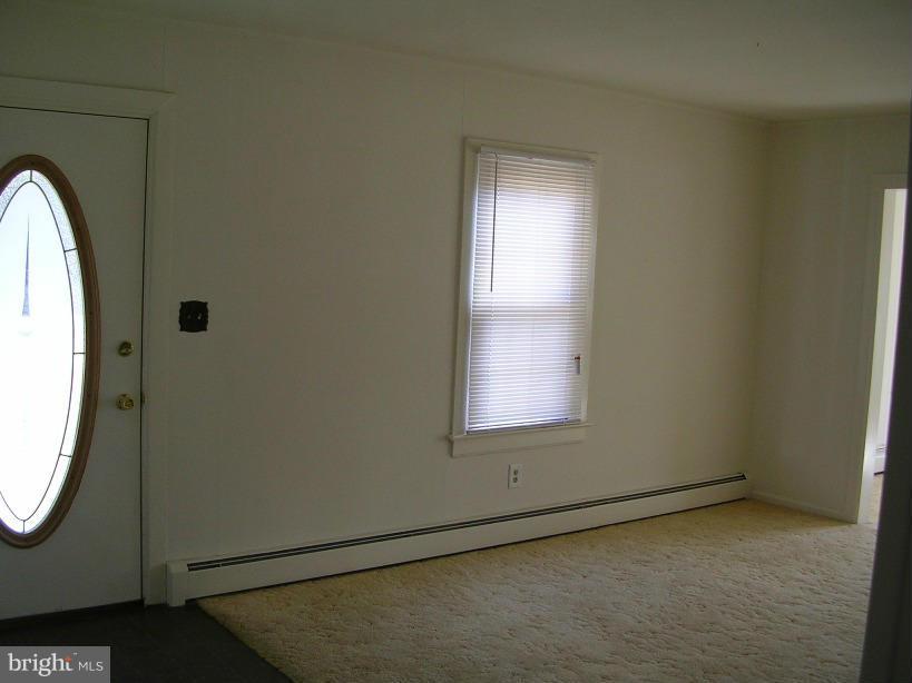 608 Wye Mills Road Queenstown, MD 21658 - Photo 2 of 17 an empty room with window