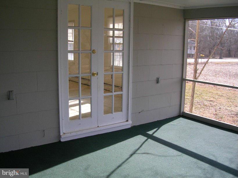 608 Wye Mills Road Queenstown, MD 21658 - Photo 13 of 17 a view of empty room with window