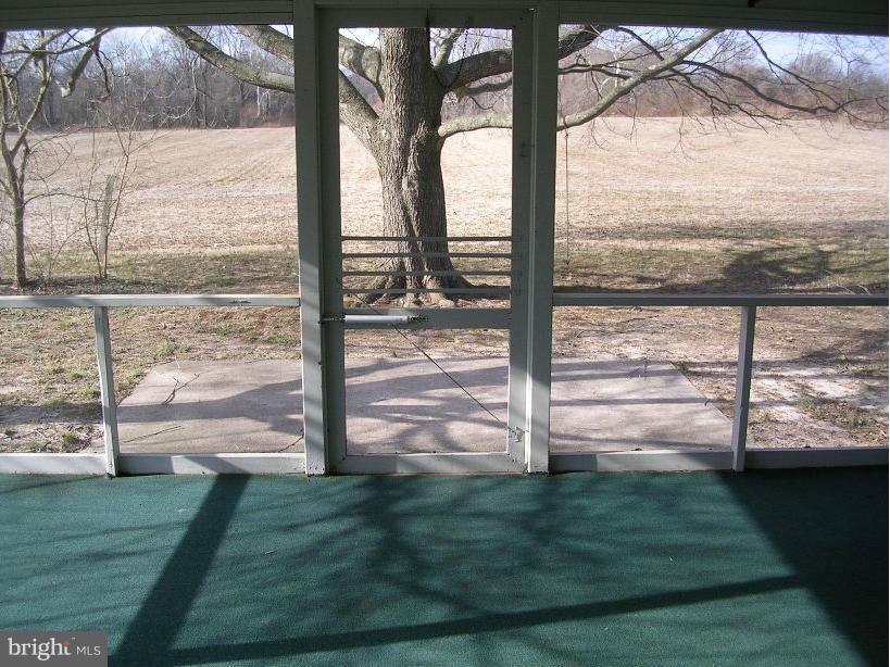 608 Wye Mills Road Queenstown, MD 21658 - Photo 14 of 17 a view of a balcony with a yard