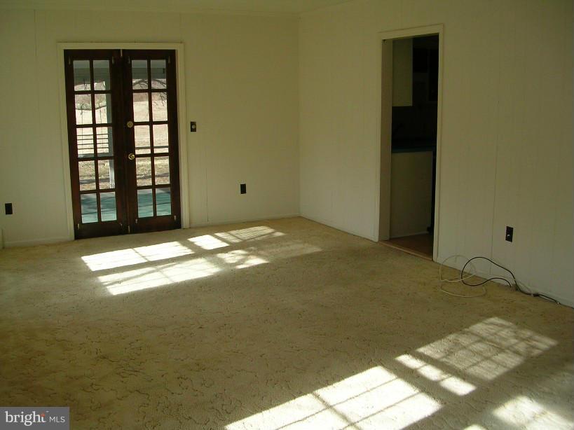 608 Wye Mills Road Queenstown, MD 21658 - Photo 3 of 17 a view of an empty room with window
