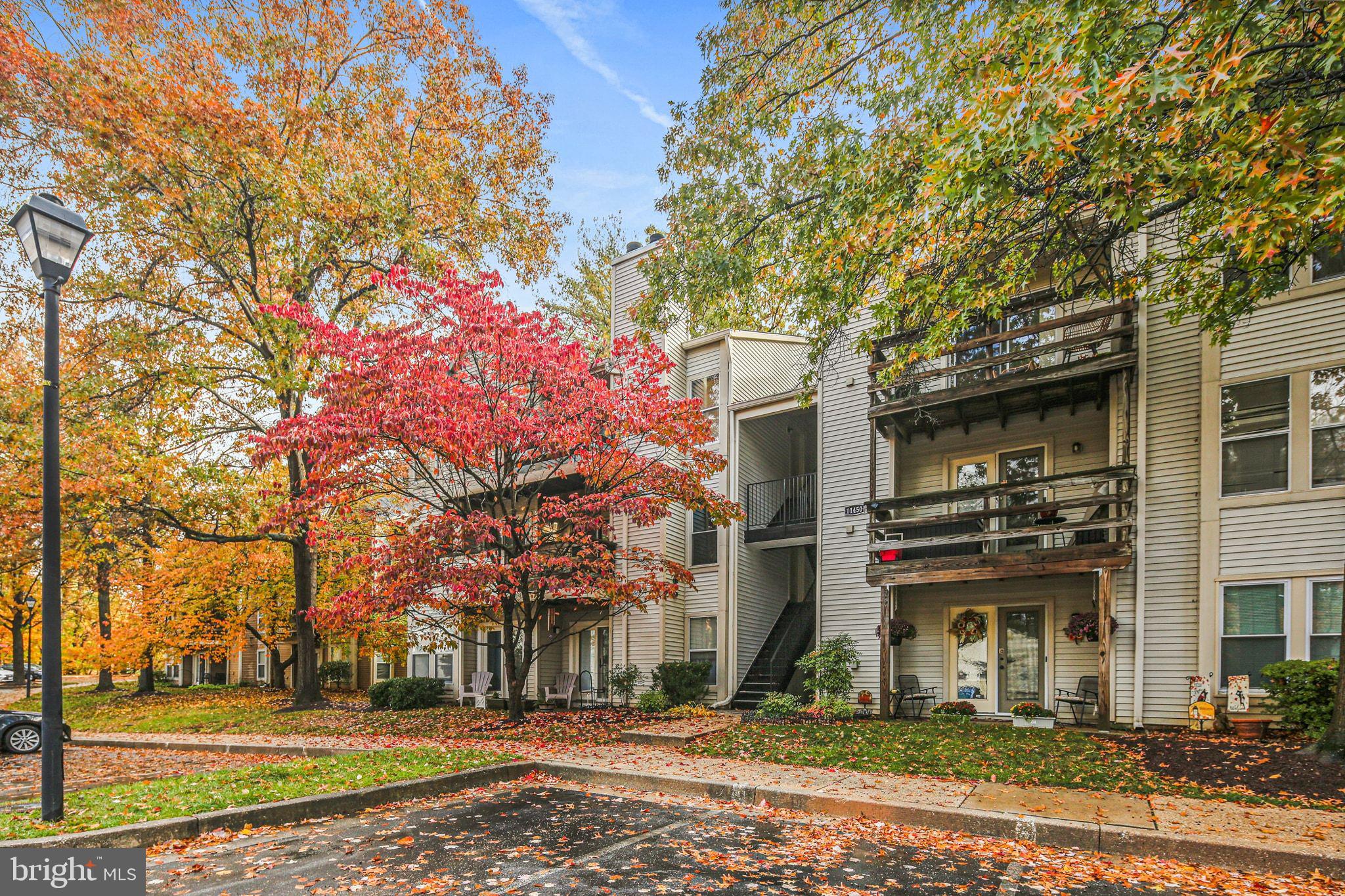 11450 Little Patuxent Parkway, Unit 605 Columbia, MD 21044 - Photo 2 of 33 a front view of a house with a yard