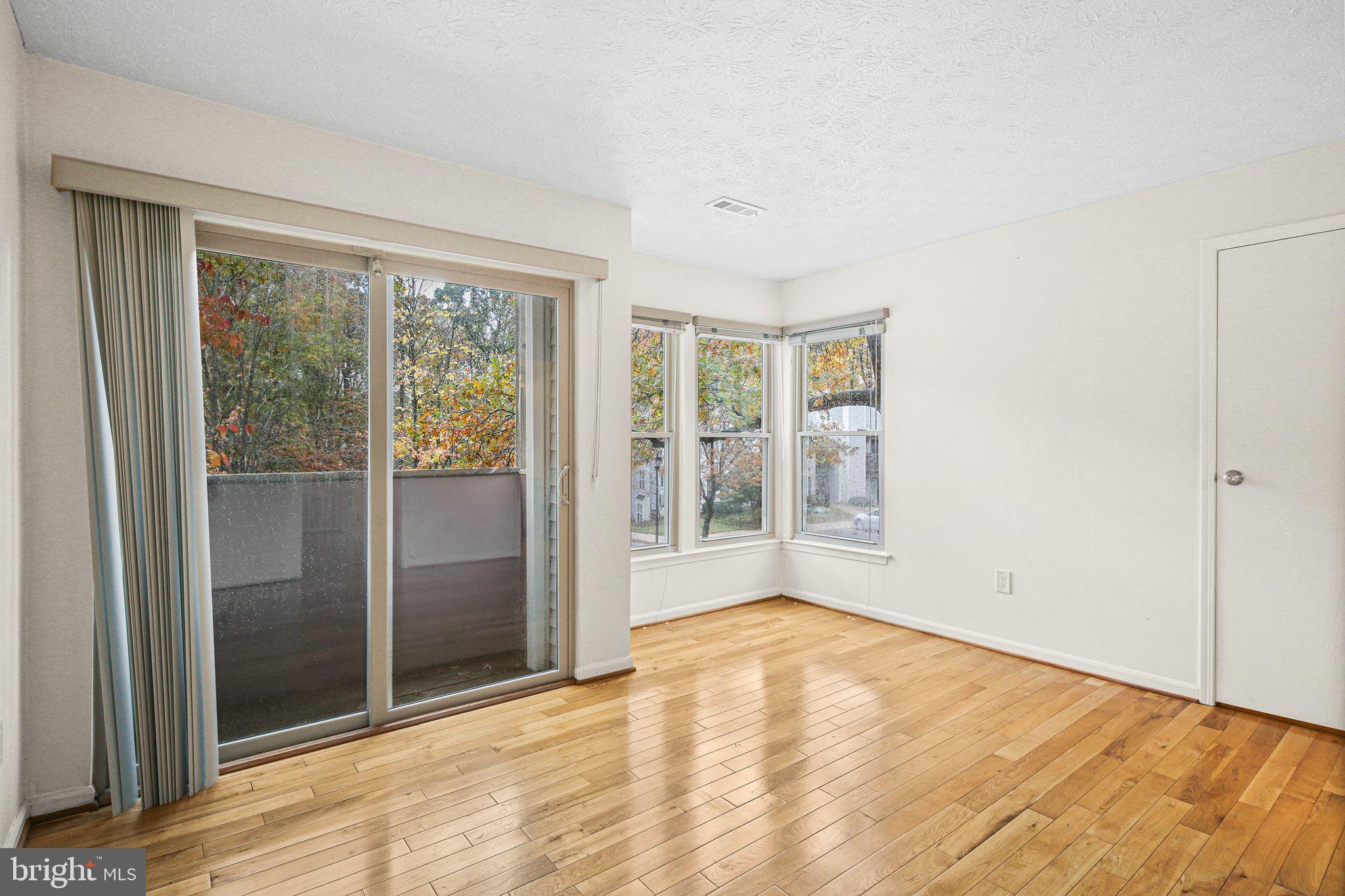 11450 Little Patuxent Parkway, Unit 605 Columbia, MD 21044 - Photo 23 of 33 an empty room with windows