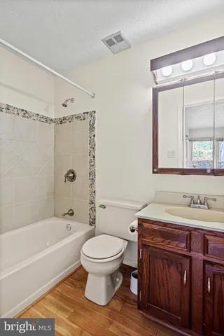 a view of a balcony with wooden floor and iron stairs