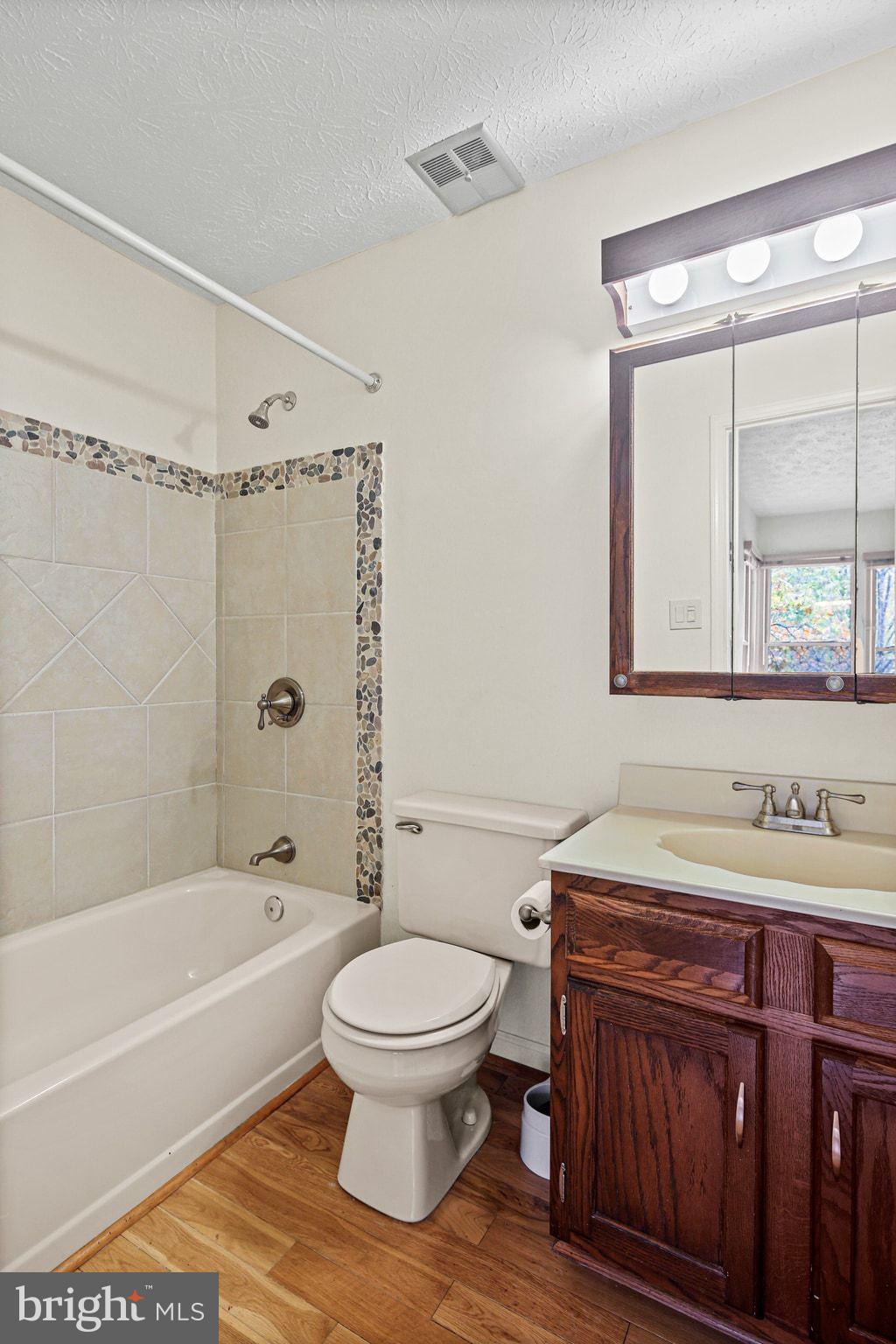 11450 Little Patuxent Parkway, Unit 605 Columbia, MD 21044 - Photo 30 of 33 a bathroom with a sink toilet and shower