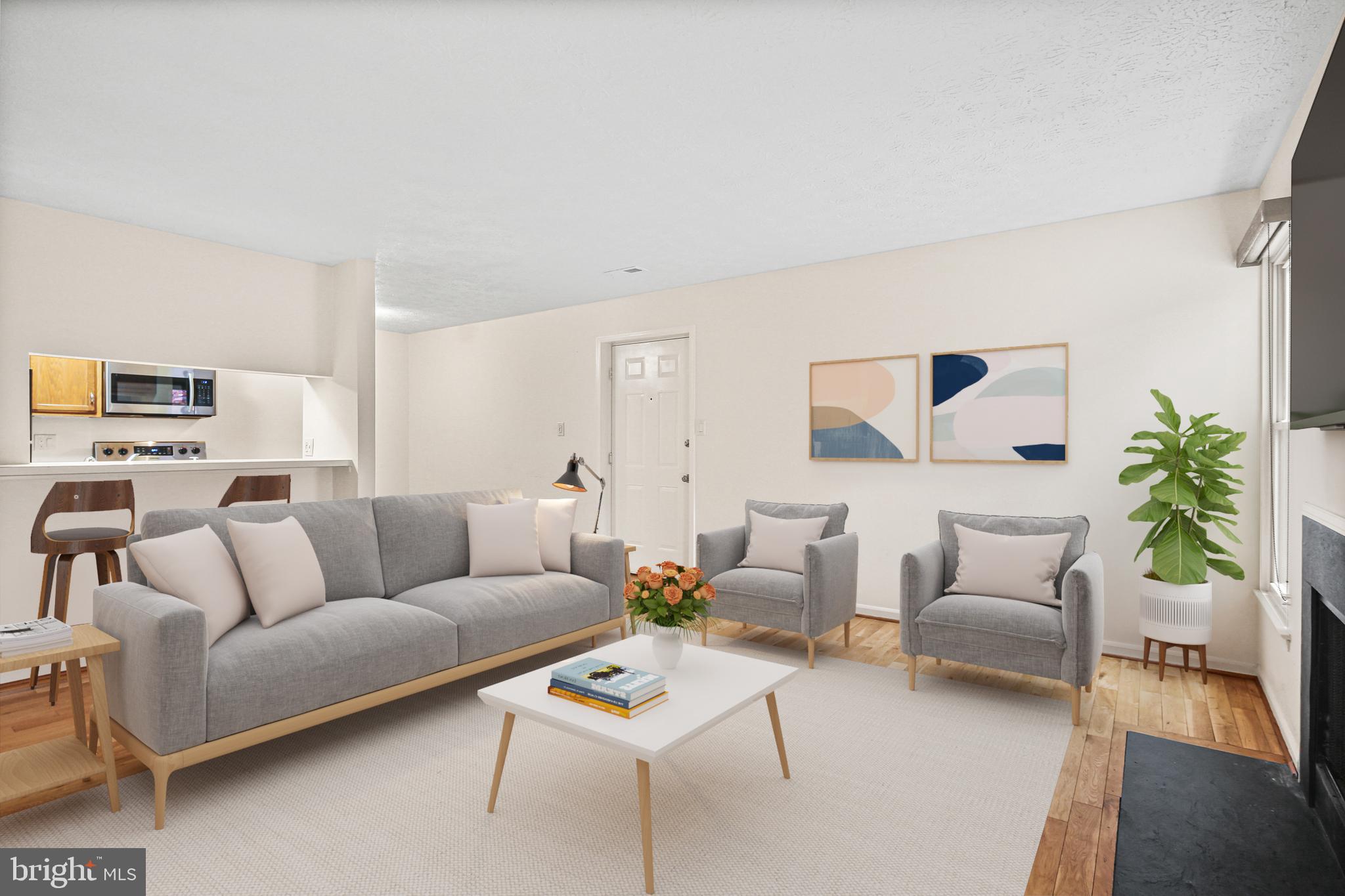 11450 Little Patuxent Parkway, Unit 605 Columbia, MD 21044 - Photo 4 of 33 a living room with furniture and a couch