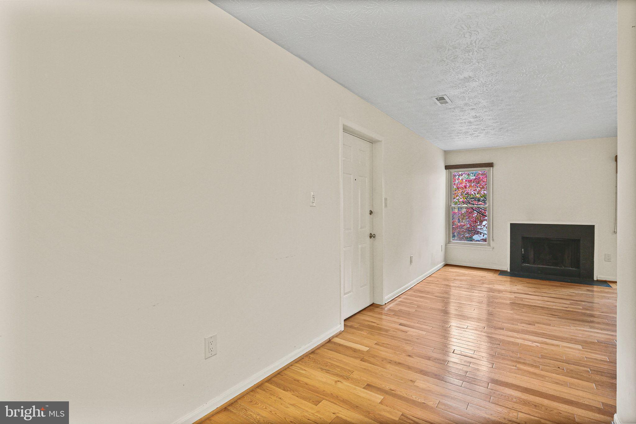 11450 Little Patuxent Parkway, Unit 605 Columbia, MD 21044 - Photo 9 of 33 a view of a hallway with wooden floor