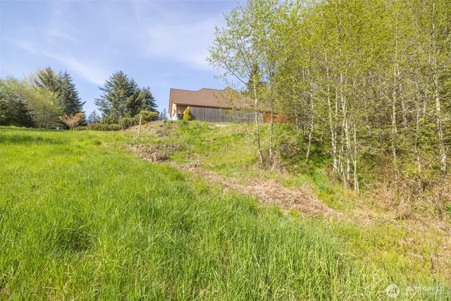 a yellow building in middle of the green field