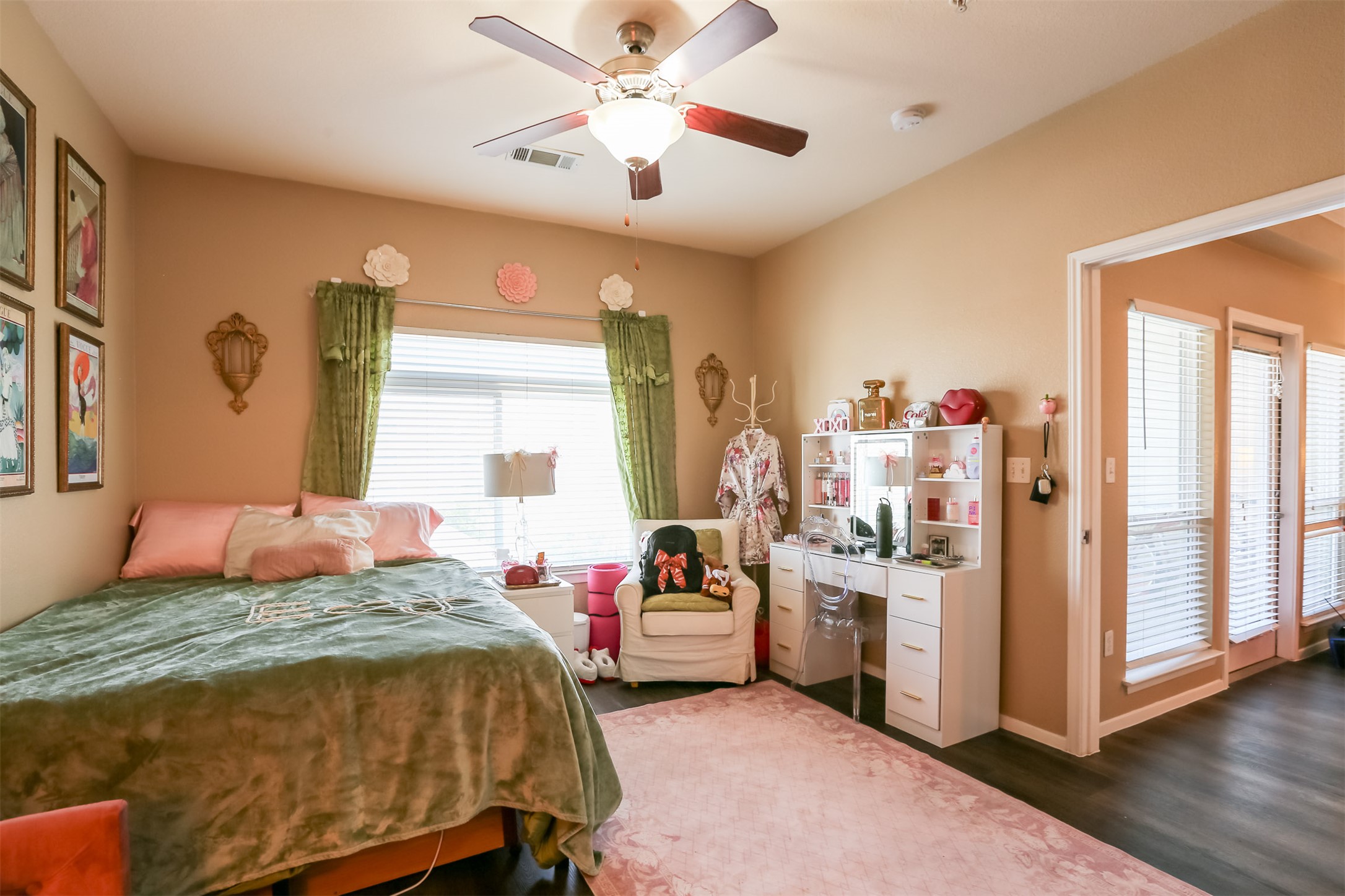910 West 25th Street, Unit 408 Austin, TX 78705 - Photo 13 of 31 a bedroom with a bed and a chandelier