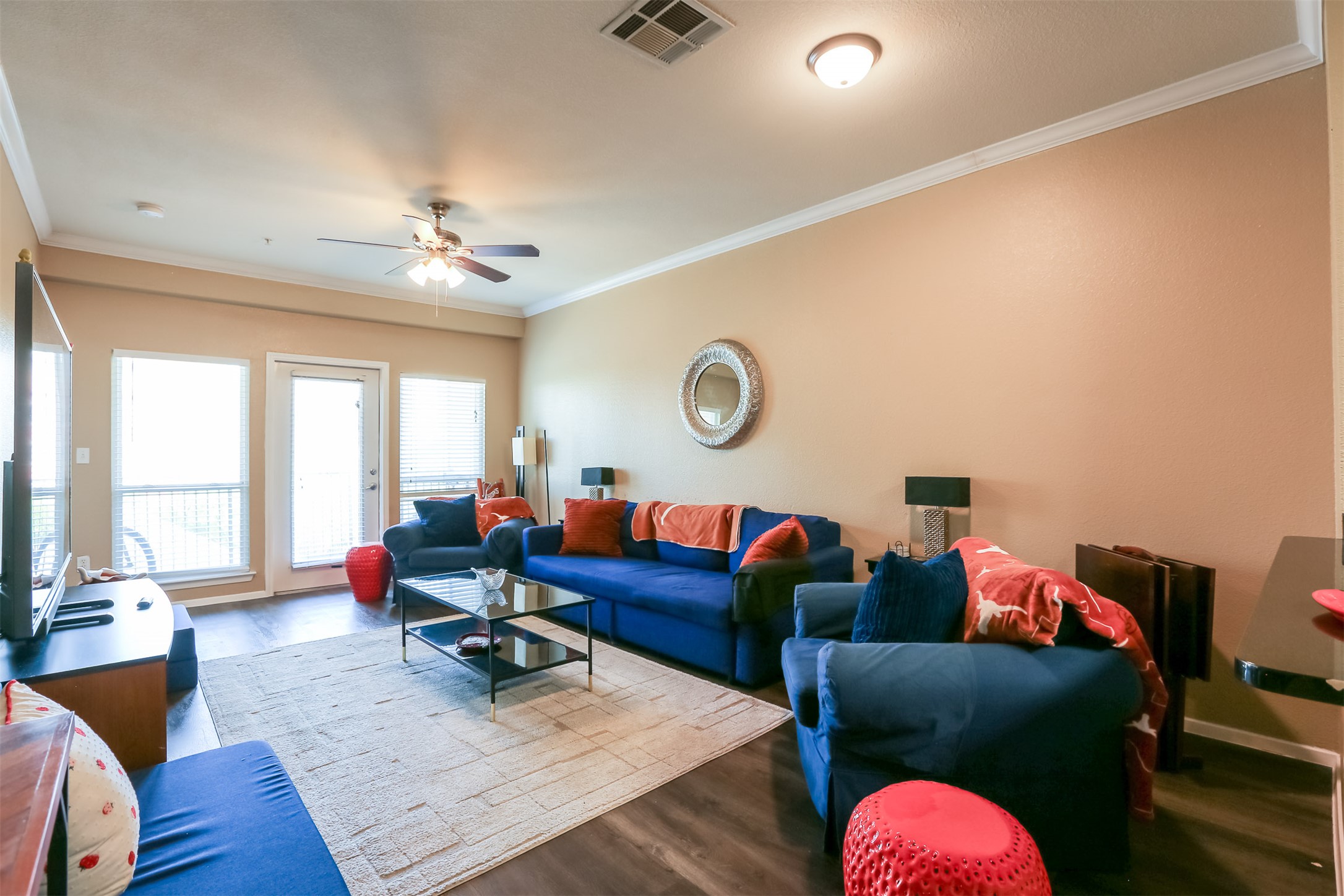 910 West 25th Street, Unit 408 Austin, TX 78705 - Photo 7 of 31 a living room with furniture and wooden floor