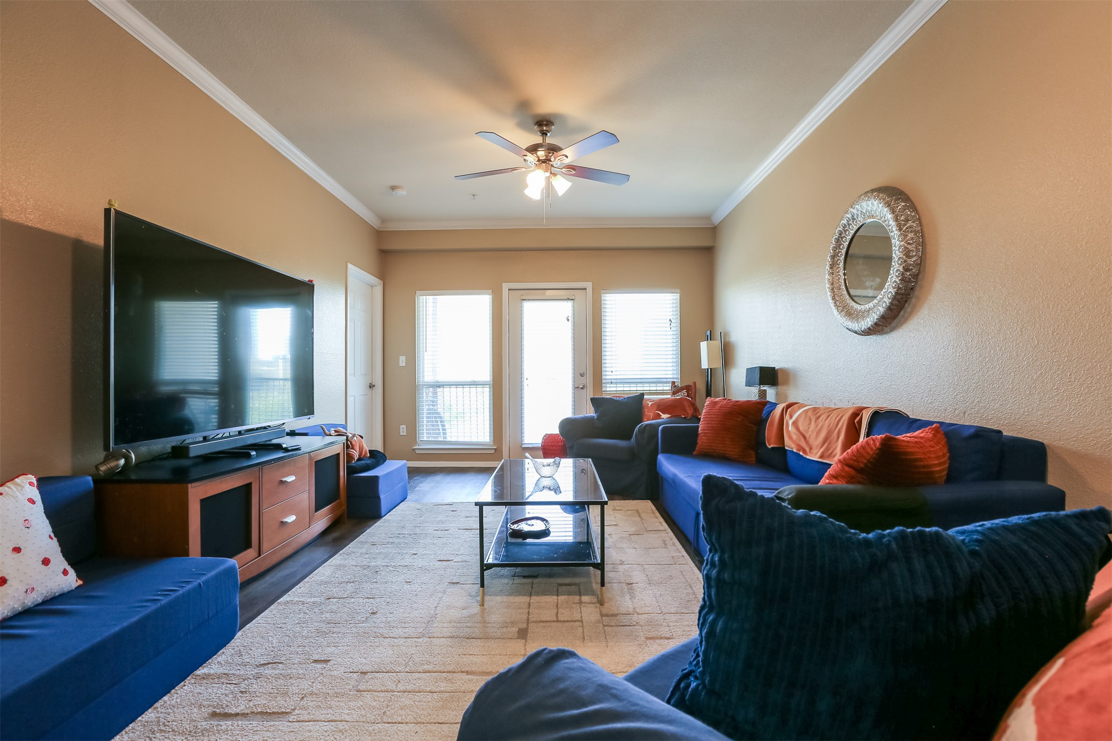 910 West 25th Street, Unit 408 Austin, TX 78705 - Photo 9 of 31 a living room with furniture and a flat screen tv
