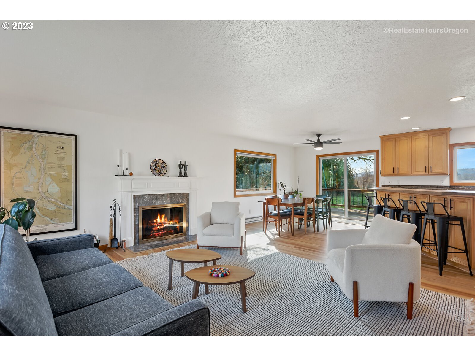 17224 Northwest Lucy Reeder Road Portland, OR 97231 - Photo 6 of 27 a living room with furniture and fireplace