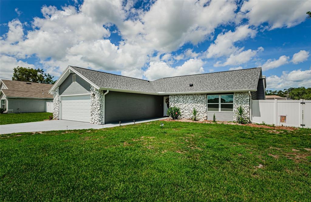 7547 Landmark Drive Spring Hill, FL 34606 - Photo 1 of 34 a house view with a garden space