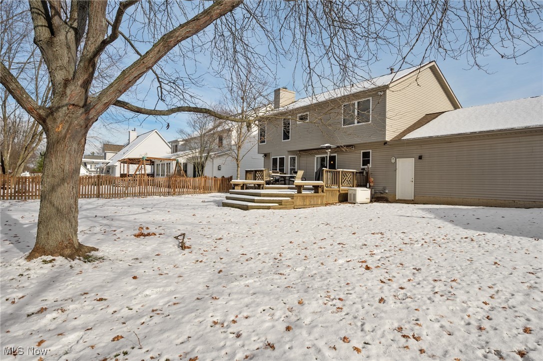 9132 Reed Road North Ridgeville, OH 44039 - Photo 33 of 43 Snow covered property featuring a chimney and a wooden deck