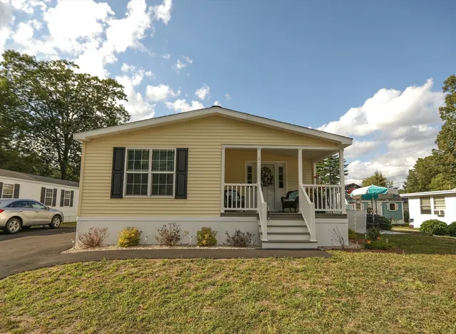 front view of a house with a yard