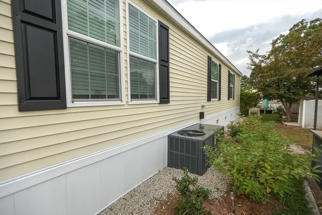 a view of house with backyard