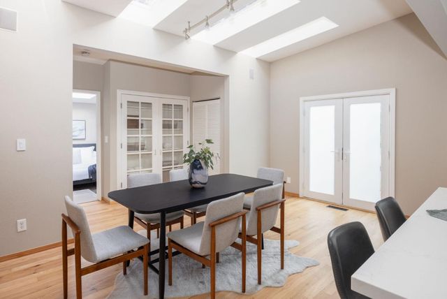 a view of a dining room with furniture and window