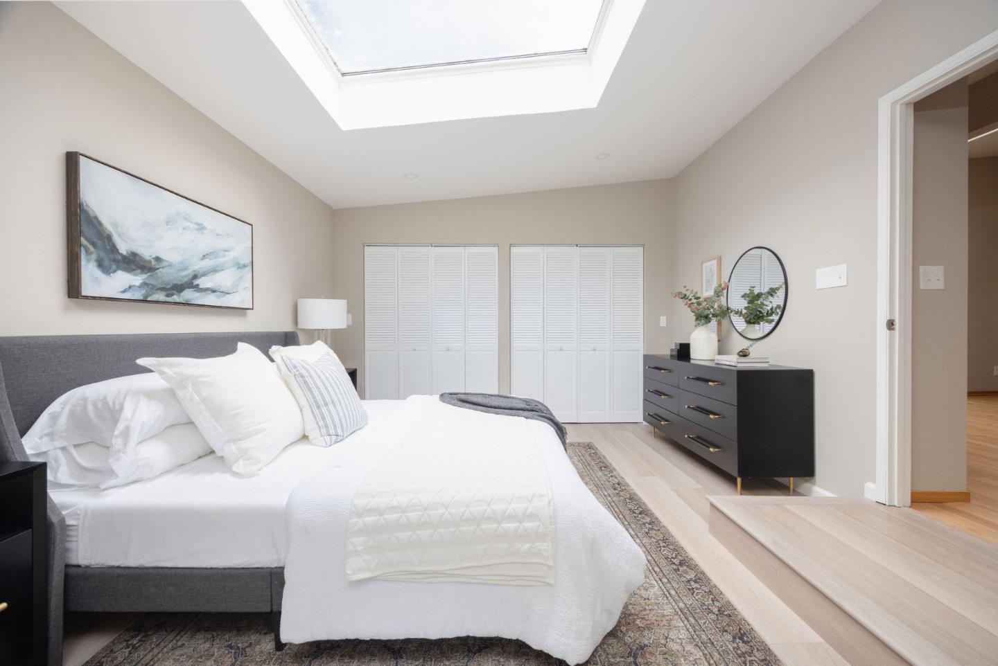 1160 Cedar Street Montara, CA 94037 - Photo 20 of 56 a bedroom with a bed and a chandelier