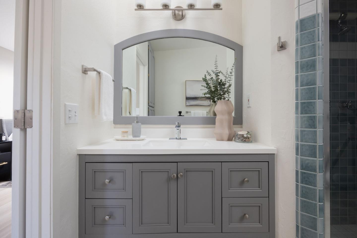 1160 Cedar Street Montara, CA 94037 - Photo 24 of 56 a bathroom with a double vanity sink and a mirror