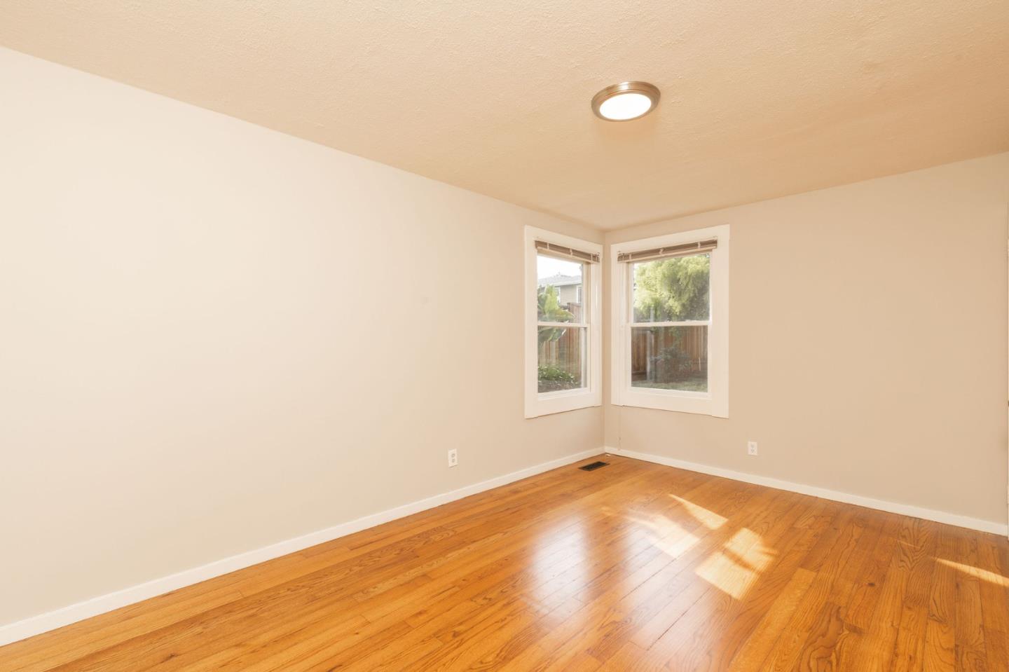 1160 Cedar Street Montara, CA 94037 - Photo 45 of 56 a view of empty room with wooden floor