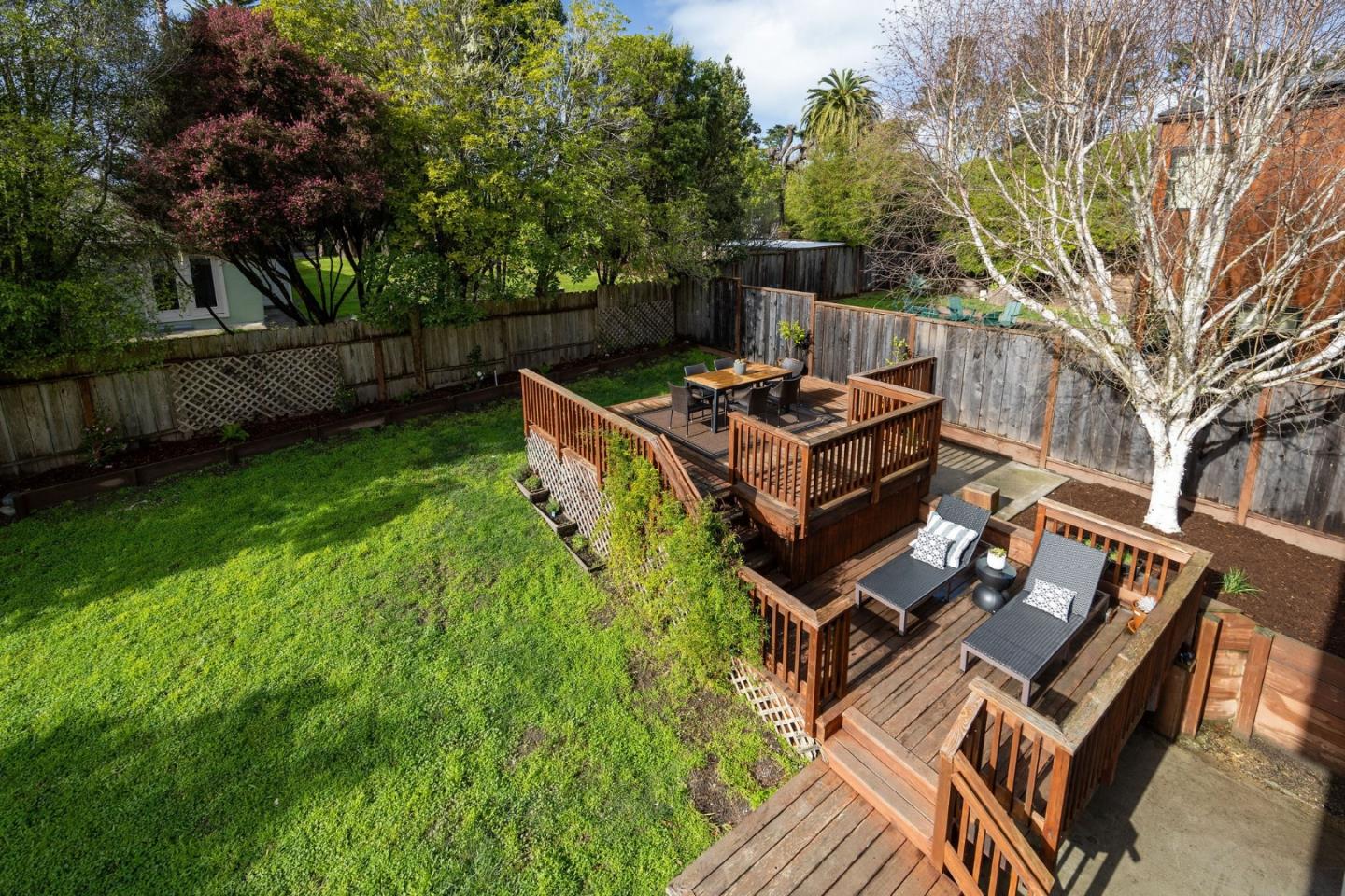 1160 Cedar Street Montara, CA 94037 - Photo 47 of 56 a view of a chairs and table on the wooden deck