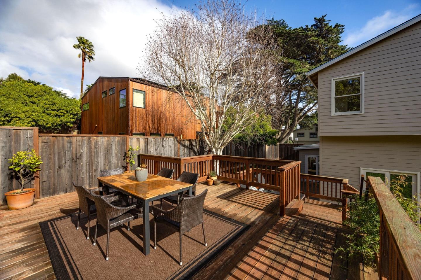 1160 Cedar Street Montara, CA 94037 - Photo 49 of 56 a backyard of a house with table and chairs