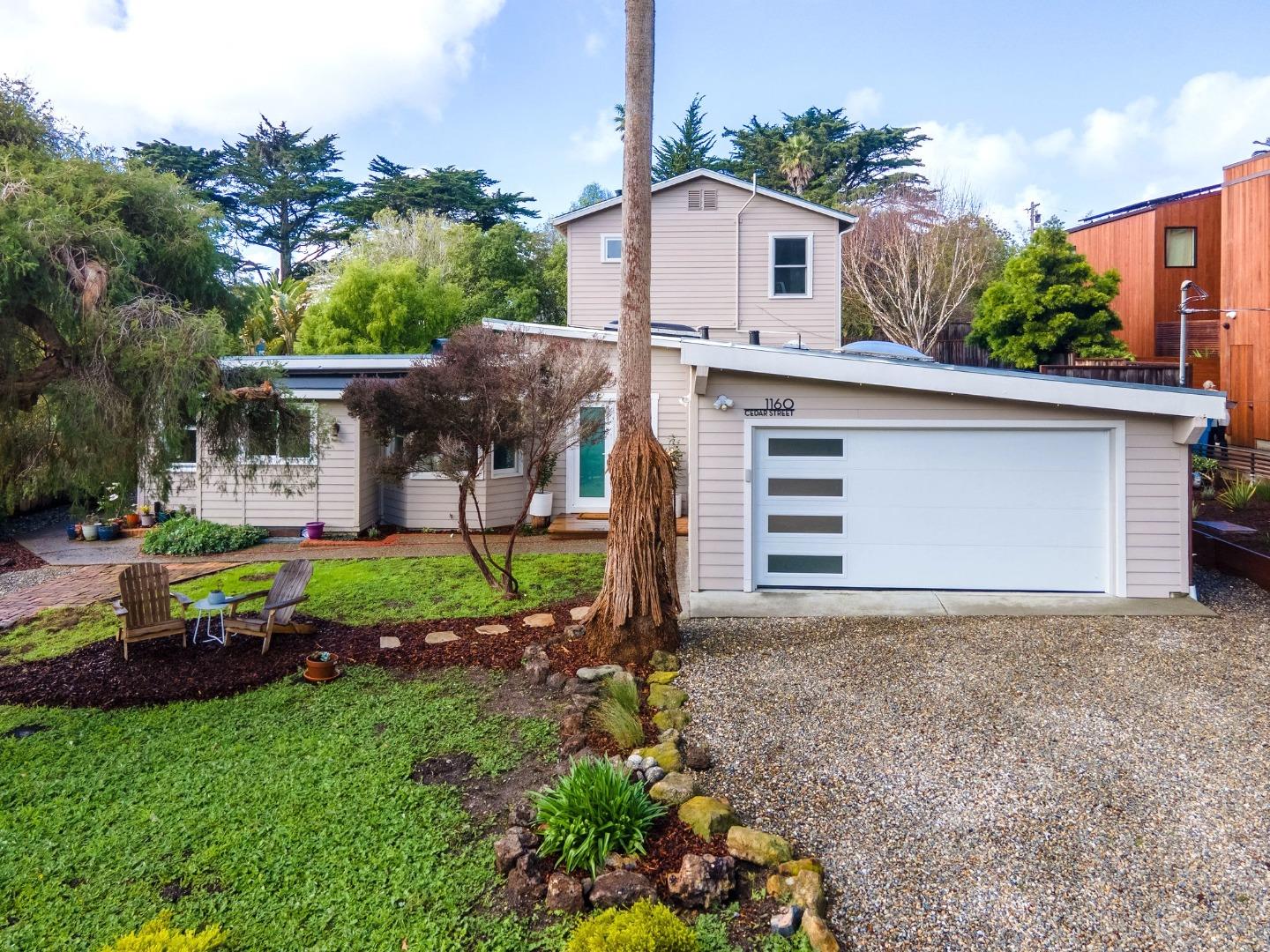 1160 Cedar Street Montara, CA 94037 - Photo 5 of 56 a front view of a house with a yard and garage