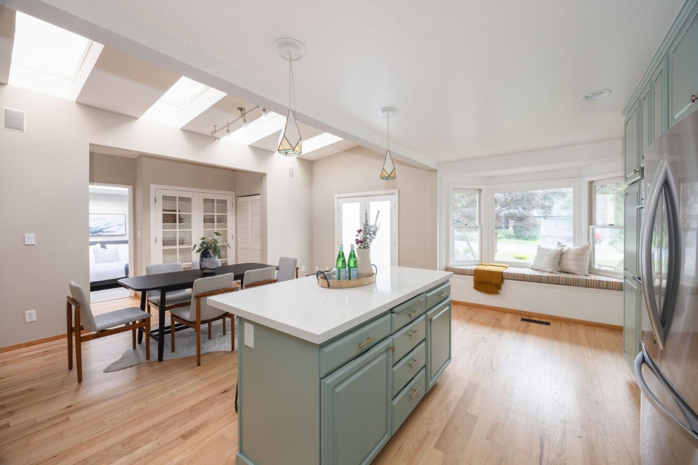 1160 Cedar Street Montara, CA 94037 - Photo 9 of 56 a large dining hall with stainless steel appliances granite countertop a stove and wooden floor