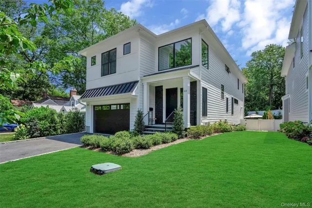 a view of a house with a yard and plants