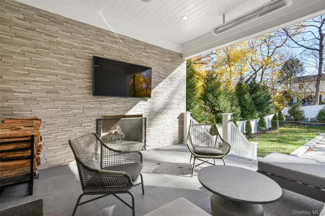 a patio with a table and chairs