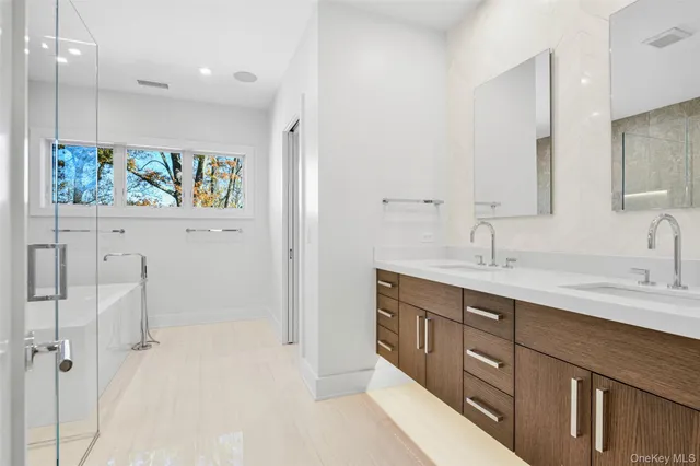 a bathroom with a double vanity sink mirror and double
