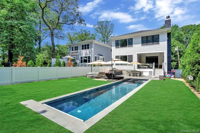 a front view of house with yard patio and green space