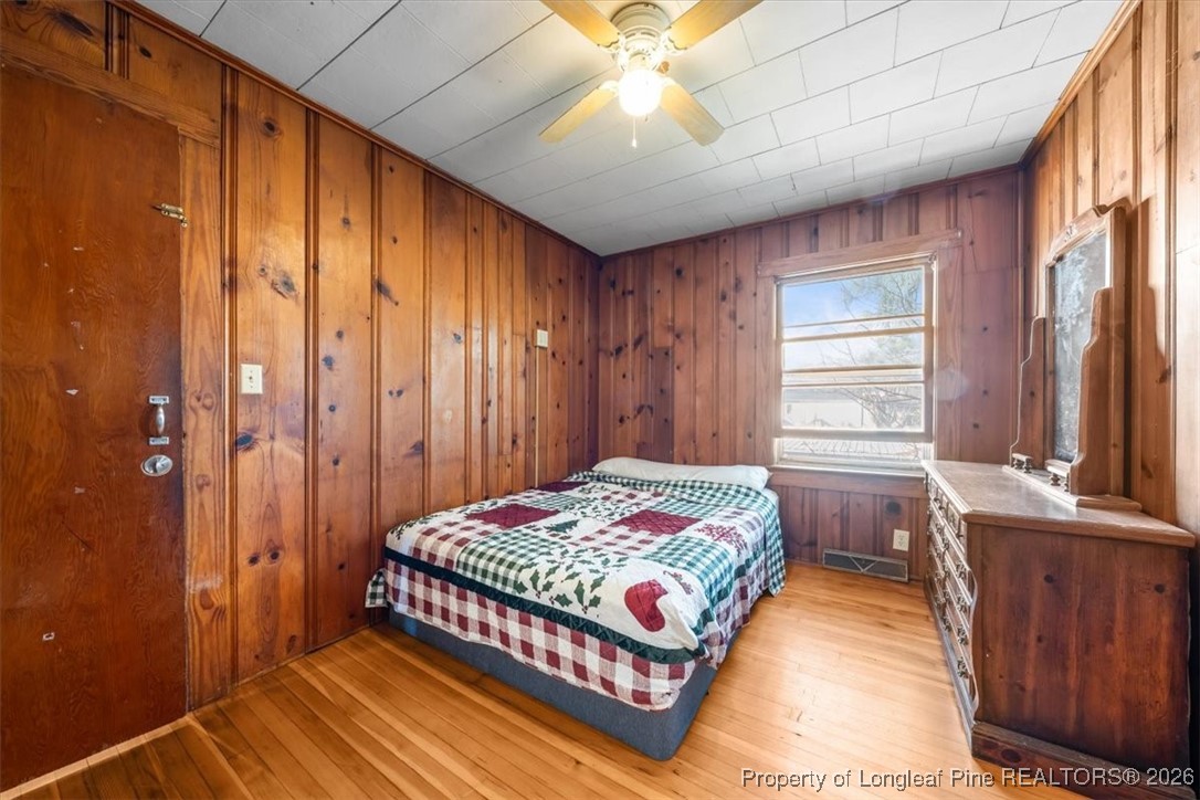 101 North Rockingham Street Robbins, NC 27325 - Photo 19 of 32 a bedroom with a bed and a window