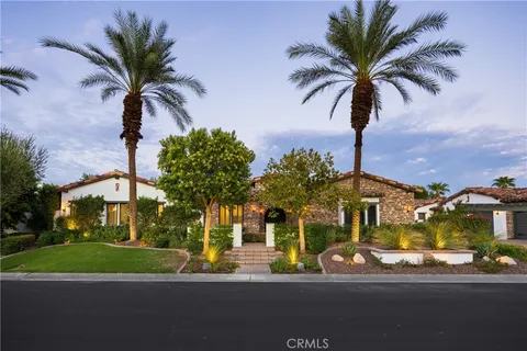 a view of a palm trees in front of a house