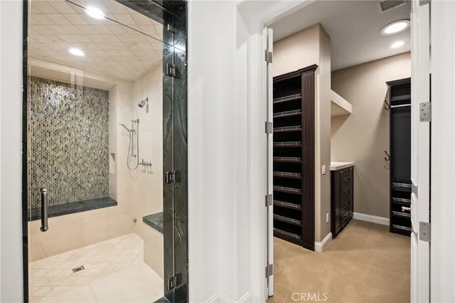 a view of walk in closet and stairs