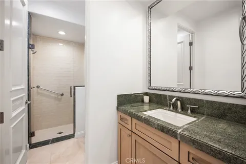 a spacious bedroom with a bed and a window