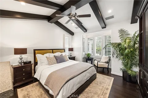 a bedroom with a large bed and a large window