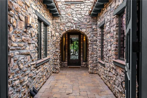 a living room with furniture potted plant and a fireplace