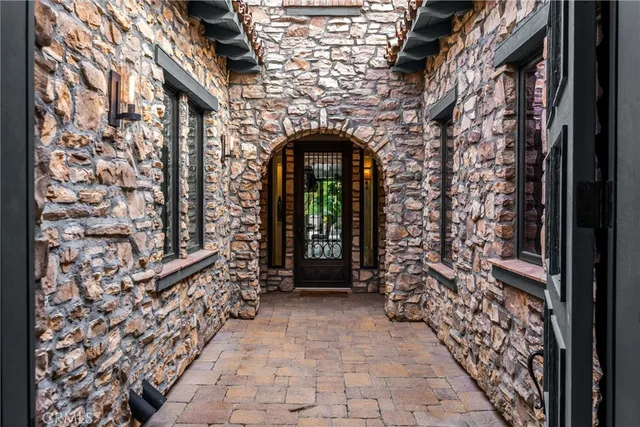 a living room with furniture potted plant and a fireplace