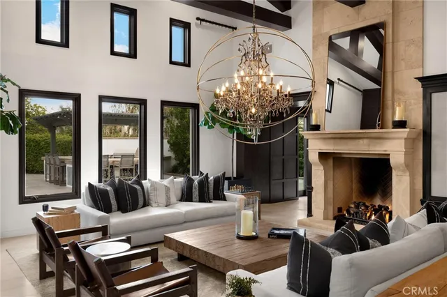 a kitchen with granite countertop a stove and white cabinets