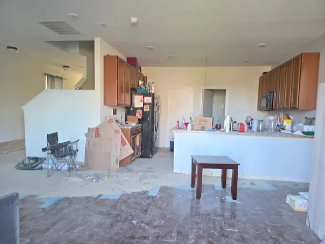 a room filled with furniture and white walls