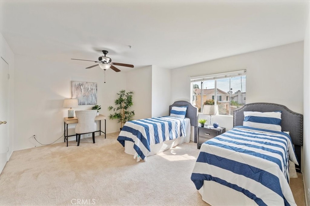 10562 Mustang Circle Montclair, CA 91763 - Photo 11 of 19 a bedroom with two beds and painting on the wall