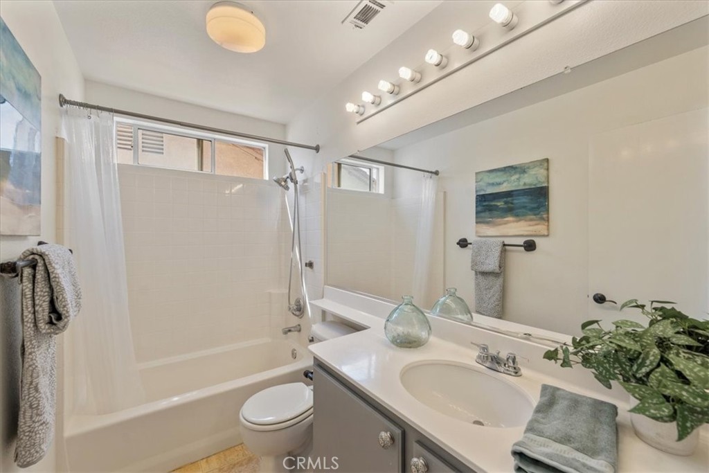 10562 Mustang Circle Montclair, CA 91763 - Photo 13 of 19 a bathroom with a sink a toilet and shower