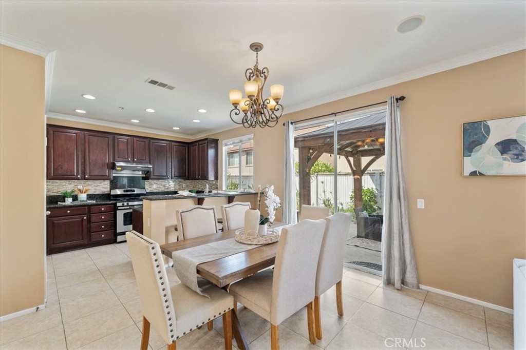 10562 Mustang Circle Montclair, CA 91763 - Photo 4 of 19 a large kitchen with a table and chairs