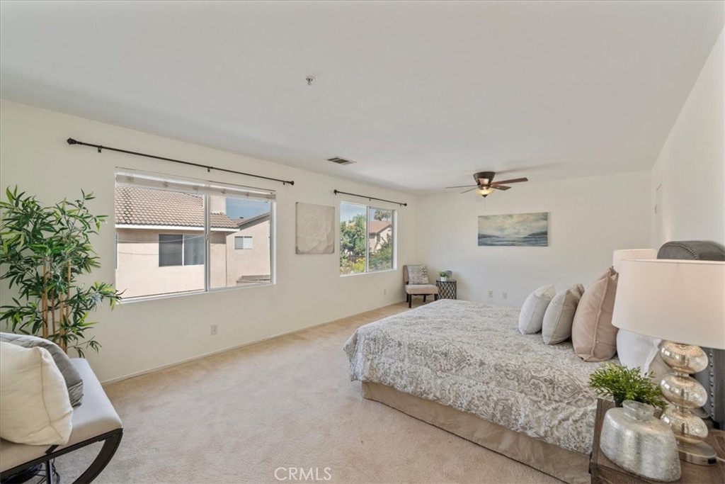 10562 Mustang Circle Montclair, CA 91763 - Photo 9 of 19 a bedroom with a bed and window