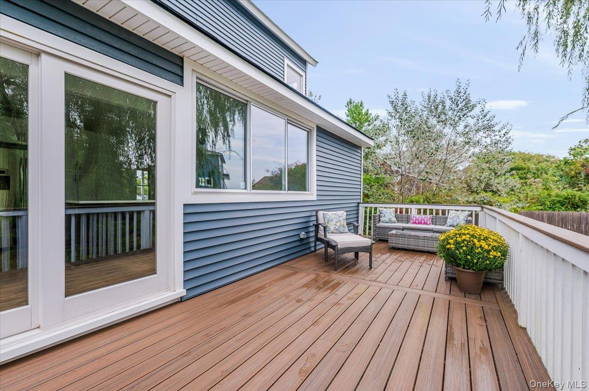 56 Oak Beach Road Babylon, NY 11702 - Photo 25 of 30 Step out to your private outdoor sanctuary featuring a brand new Trex deck which is maintenance free so you can enjoy hosting friends and family.