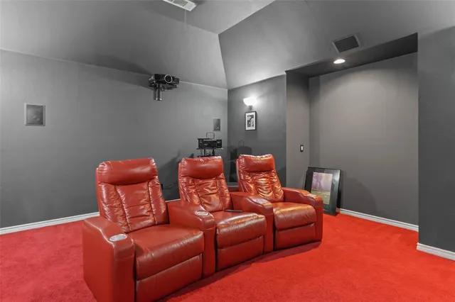 a projector room with furniture and a lamp