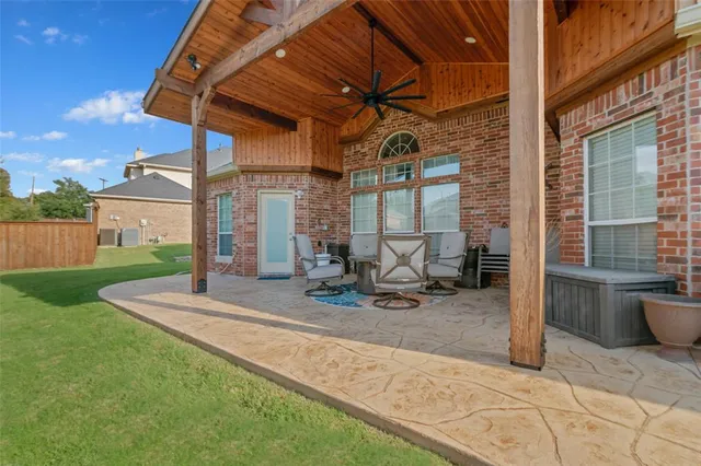 a view of a house with backyard porch and sitting area